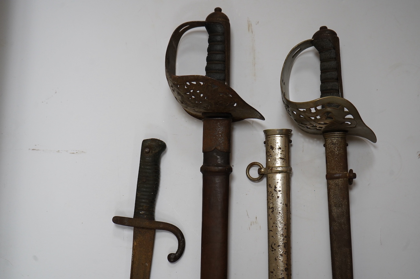 A Victorian 1895 pattern infantry officer’s sword by Robert Mole and Sons, with regulation plated brass guard, in its steel dress scabbard, together with an 1897 pattern Edward VII officer’s sword by Wilkinson (unnumbere